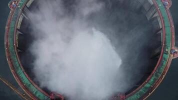 A closer look at hydro electric power plant with its white smoky mist clouds video