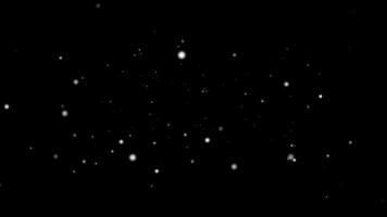 A black and white image of snow falling on the ground video