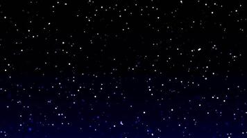 A dark blue sky with snow falling from the sky video