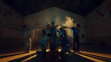 Group of children in a dimly lit gymnasium, huddled around a mysterious glowing object video
