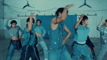 Vintage photo of a group of young people practicing dance moves in a studio with a retro aesthetic. video