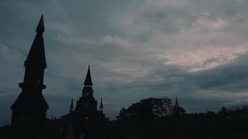 Silhouetted Gothic Towers Against a Moody Sky video