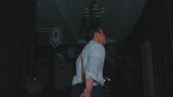 Mysterious Man in Suspenders Walking Through Dim Room video