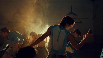 Group of people dancing in a room with atmospheric back light video