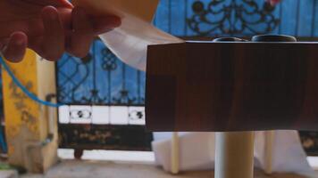 Hand Adjusting Knob on Wooden Surface video