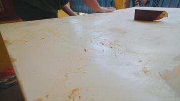 Sanding a Wooden Surface in a DIY Project video