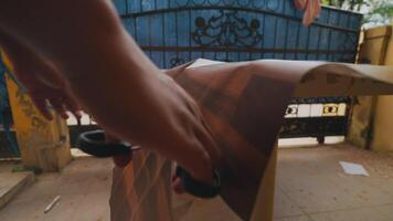 Close-Up of Patterned Paper Against Blue Gate video
