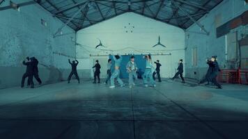 Group of people dancing in an industrial warehouse setting. video
