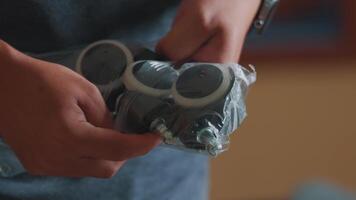 Close-Up of Hands Gripping a Small Gadget video