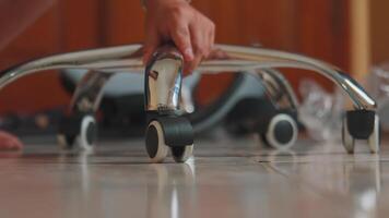 Close-Up of Chair Assembly with Focus on Wheels video