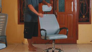 Adjusting a Modern Office Chair in a Cozy Room video