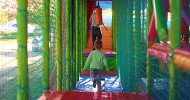 Child Playing in Colorful Outdoor Playground Tunnel video