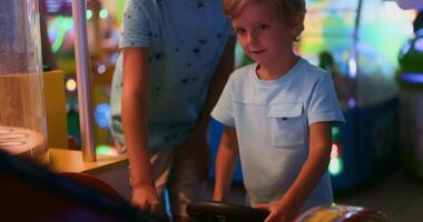 Child Enjoying Arcade Game in Vibrant Gaming Center video