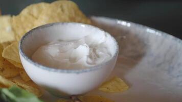 Enjoying nachos with creamy dip at a local eatery video