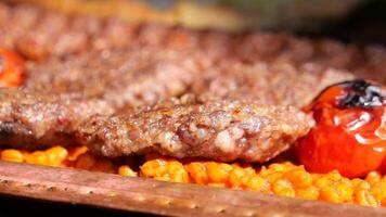 Grilled meat served with flavorful rice and vegetables video