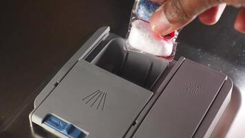 loading a dishwasher with a detergent pod video