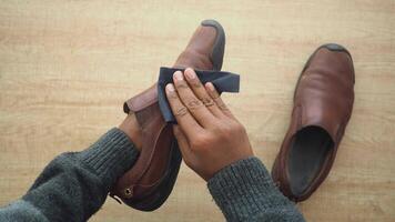 Cleaning brown shoes with a soft cloth at home video