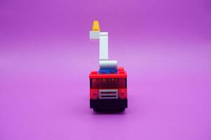 Creative Firefighter Vehicle Toy on Vibrant Background photo