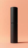Blank black matte tube container skincare or perfum spray for men, vertical story peach background photo