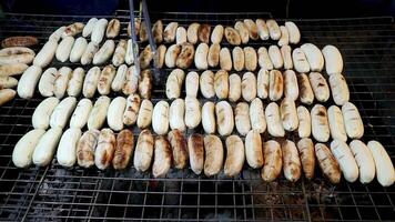 Thai bananas roasting on charcoal stove, authentic street food dessert. Rustic sweet aroma and local charm capture the essence of Thai culinary tradition. video