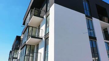 Newly built modern apartment building facade. Exterior of multi storey building. Modern design of urban architecture video