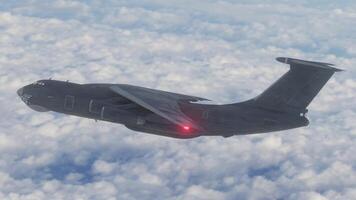 A military plane flying in the sky with clouds in the background video