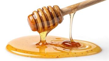 Delicious honey dripping from a wooden dipper. photo