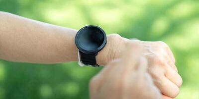 Seniors using smart technology for health monitoring outdoors photo