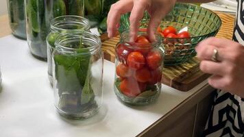 A person prepares homemade pickles with fresh vegetables, showcasing sustainable practices and culinary traditions video
