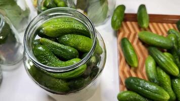 Fresh cucumbers in a jar evoke pickling traditions, organic farming, and culinary arts, highlighting sustainability and homemade preserves video