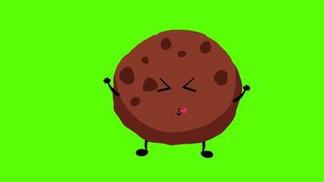 a cartoon cookie character with a face and arms on a green background video