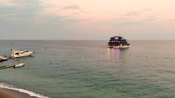 Turkey Antalya 09.27.2024 Sunset sea view with anchored yachts and cruise vessel video