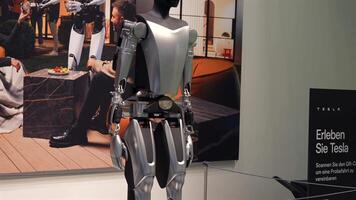 Tesla Bot robot rear view with lifestyle backdrop Berlin Germany May 28 2025 video