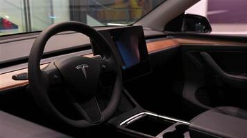 Close up of Tesla dashboard with screen and wood trim Berlin Germany May 28 2025 video