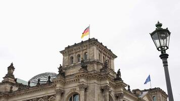 Reichstag building ornate architecture with flags and dome close up 17 May 2025 video
