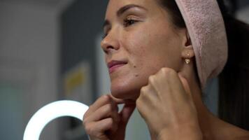 Jawline massage with knuckles in side view closeup video