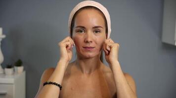 Cheekbone massage with knuckles in beauty routine video