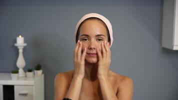 Forehead massage with fingertips during skincare routine video