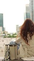 Happy woman talking on phone in business district video