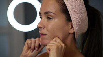 Jawline massage with knuckles in soft ring light video
