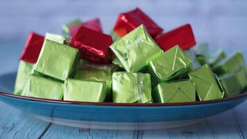 Colorful candy assortment on a plate in a bright setting video