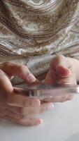Examining mobile device while seated indoors video