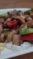 Grilled chicken and vegetables served with creamy sauce video
