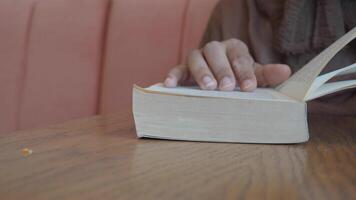 Reading quietly in a cozy cafe setting video