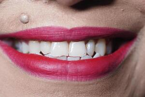 Bright smile with vibrant lipstick in close-up view photo