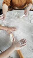 Hands-on Learning in the Kitchen as Mother Teaches Child to Make Pita Dough video