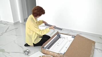 Unpacking and Preparing Furniture for Assembly in a New Apartment video