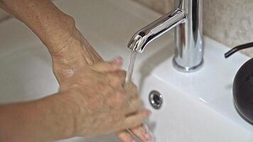 Embracing the Cleansing Ritual With Water and Hands at a Modern Sink video