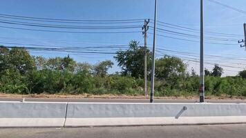 Passing landscape with trees and power lines video