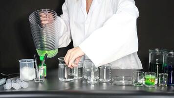 Scientist conducting experiment with liquids and tools video